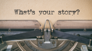 Paper in typewriter that says "What's your story?"